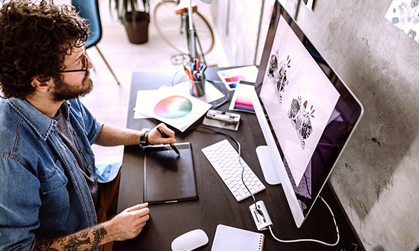 man working on a desktop computer