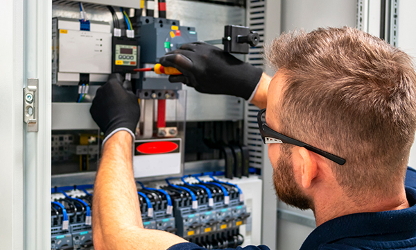 Man working on an electrical box