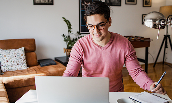 man sitting at computer