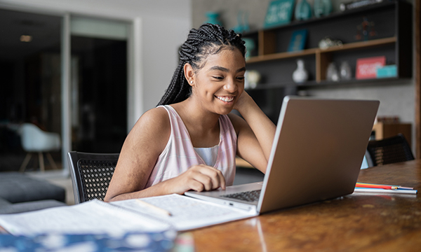 woman sitting at desk with laptop