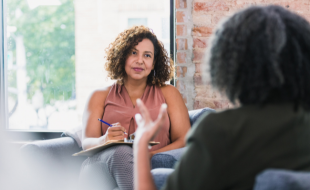 Mental health professional listening to patient